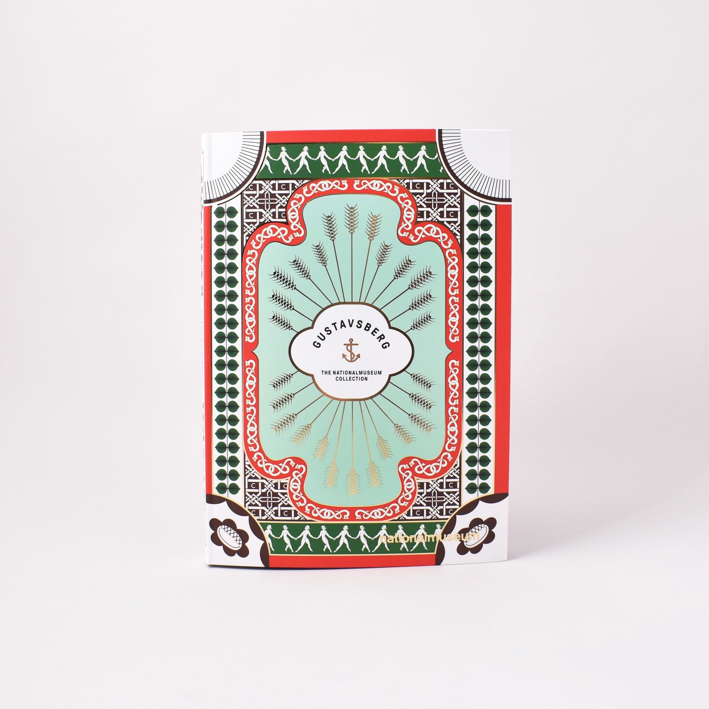 Framsida till bok om Gustavsberg från NAtionalmuseum med mönster från fabrikens mest välkända serviser