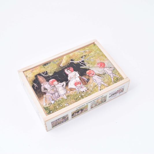 fyra träpussel i låda med elsa beskows tomtebobarnen