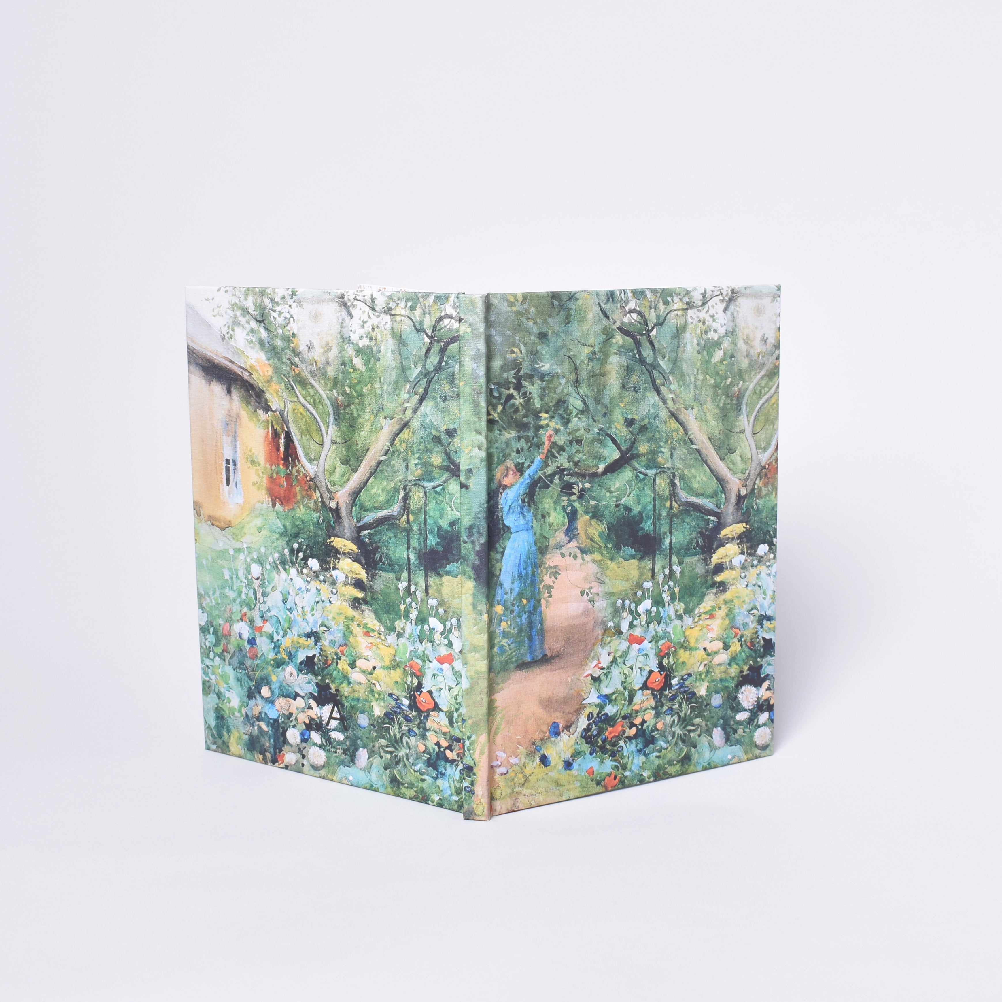 Inbunden anteckningsbok med Carl Larssons målning Trädgårdsscen från Marstrand