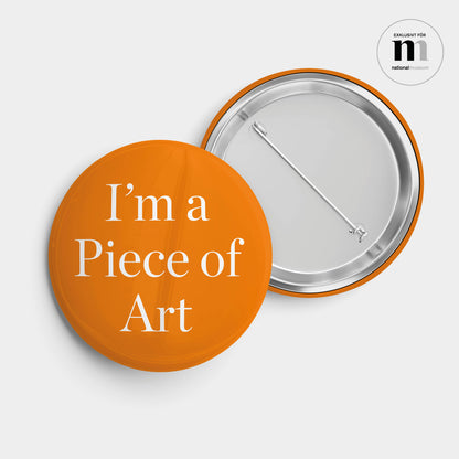 rund badge med nål i orange och texten I'm a piece of Art från Nationalmuseum