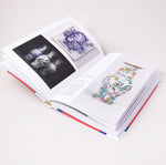 Ladda upp bild till gallerivisning, Insida i boken om Gustavberg med bilder på urnor och emalj
