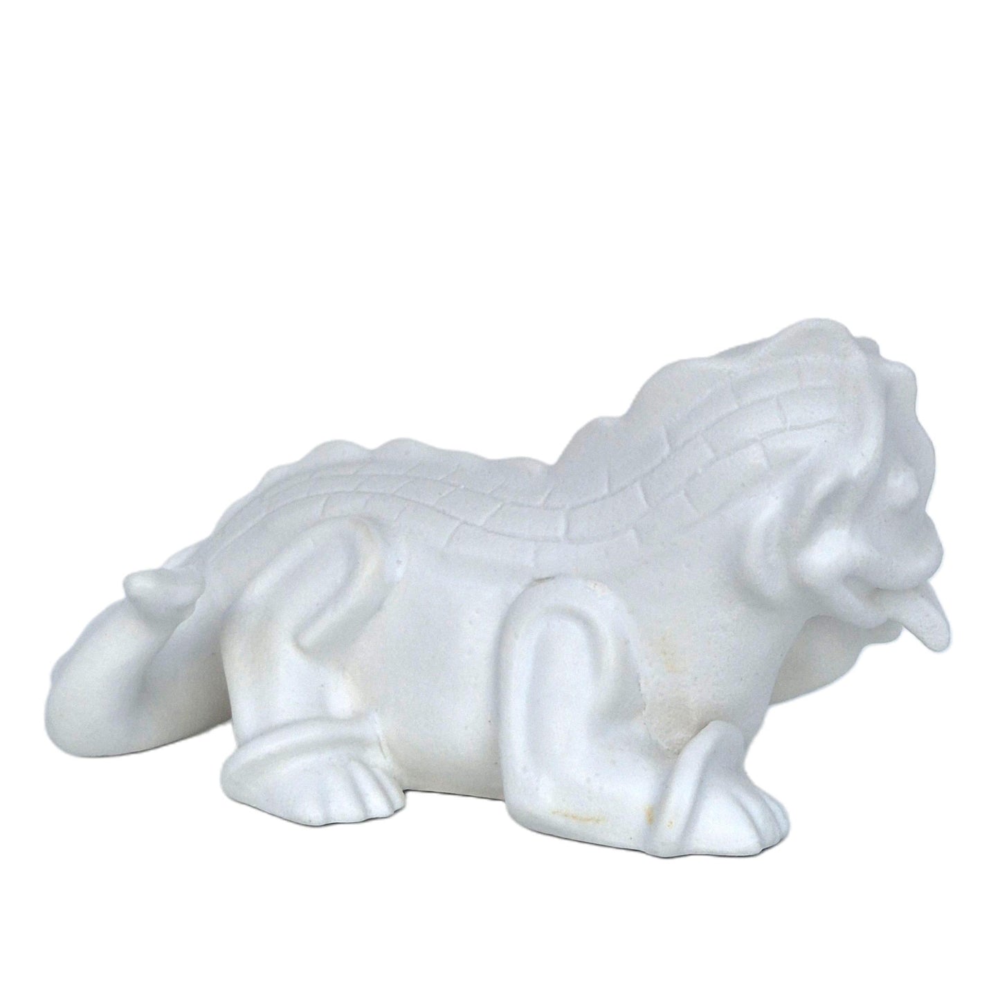 Baksida av vit figurin från Wilhelm Kåges kollektion Drakvalpar