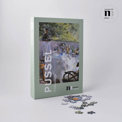 pussel i snygg grön kartong med målningen frukostdags från Nationalmuseum