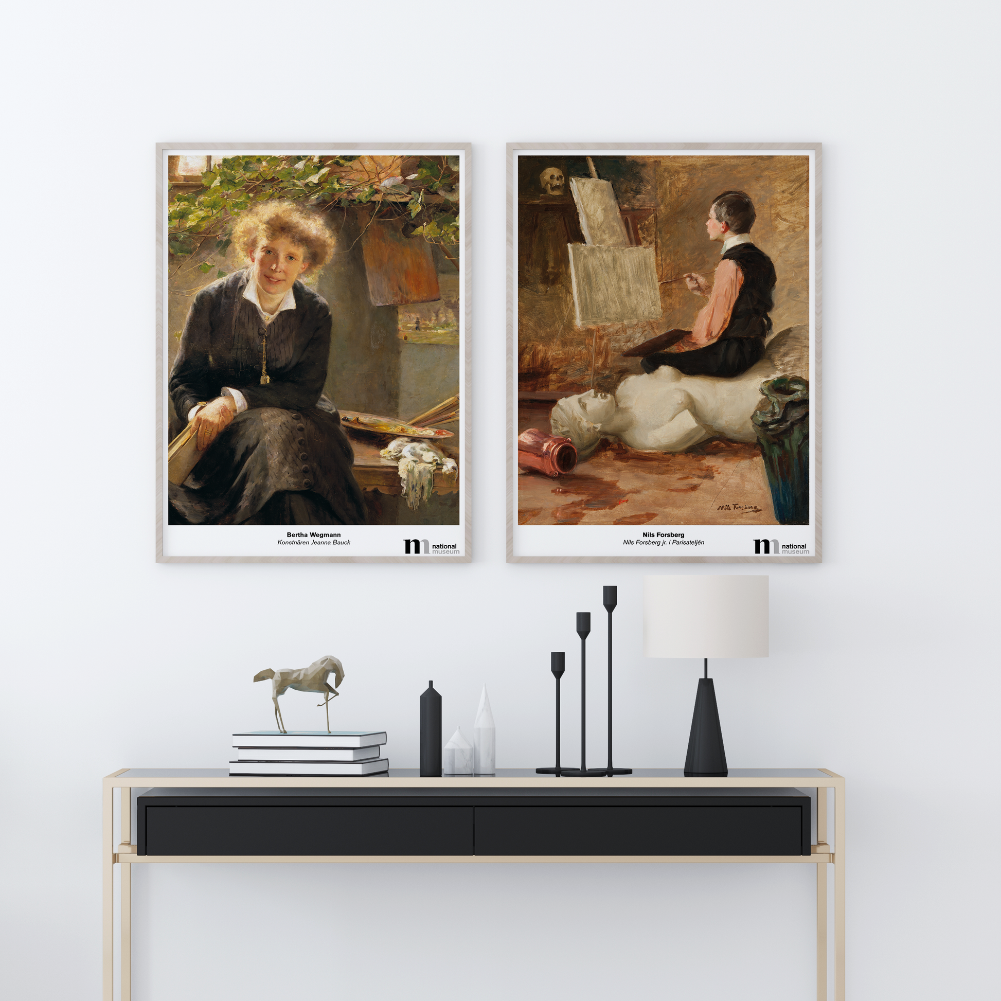 två posters inramade på en vägg föreställande motiv av bertha wegmann och nils forsberg