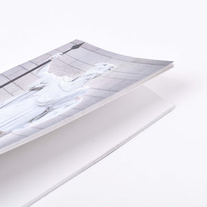 Långsmal anteckningshäfte med omslagsmotiv av Bengt Erland Fogelbergs skulptur Oden och blanka sidor