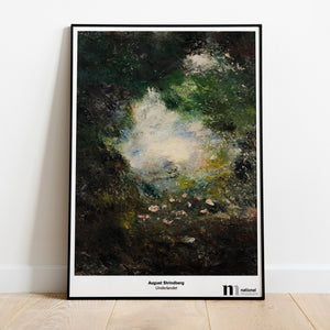 Poster med August Strindbergs Underlandet i svart ram lutad mot en vägg